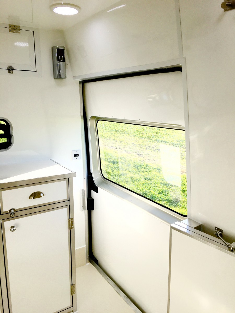 Interior view of the mobile groomer showing safety doors